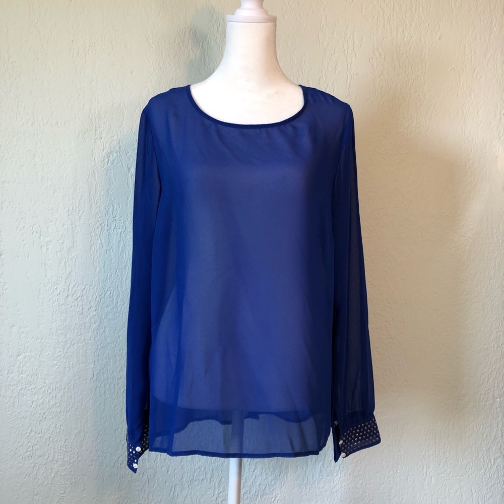 Sheer blue long sleeved blouse.Gold rivet embellishments cuffs & down back seam.